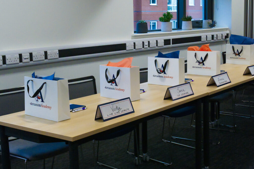 Goodie bags set up for an Arcanum Academy social media workshop.