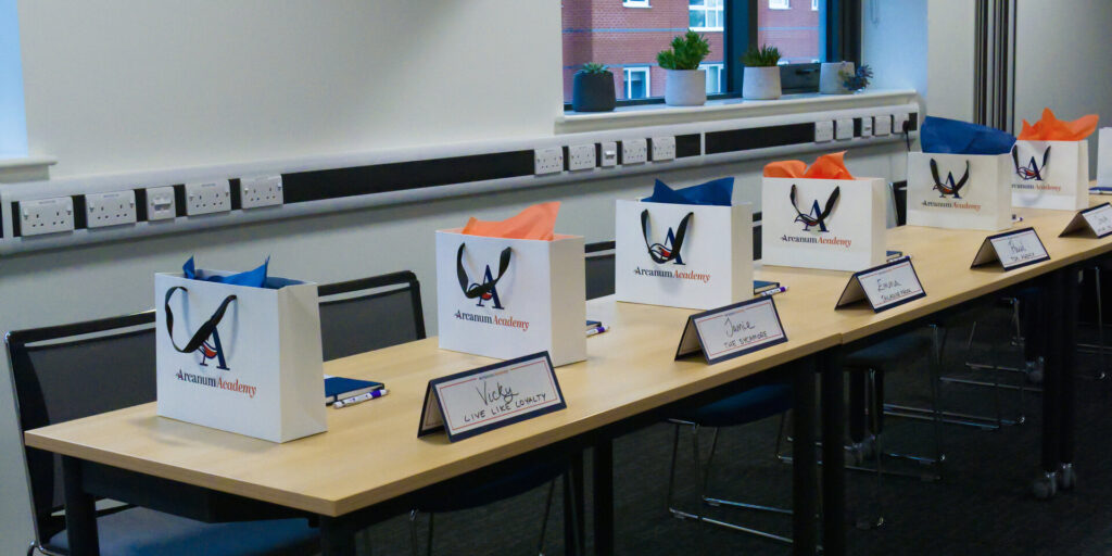 A conference room set up for an Arcanum Academy Social Media Workshop.