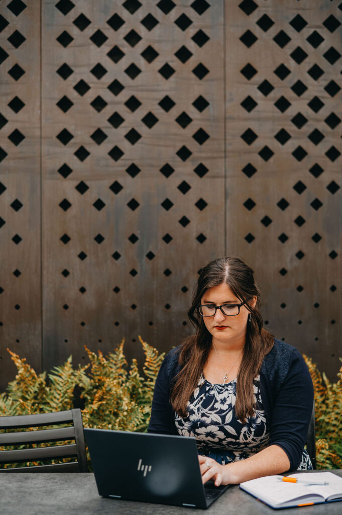 Eleanor Bryan sat at a table on her laptop.