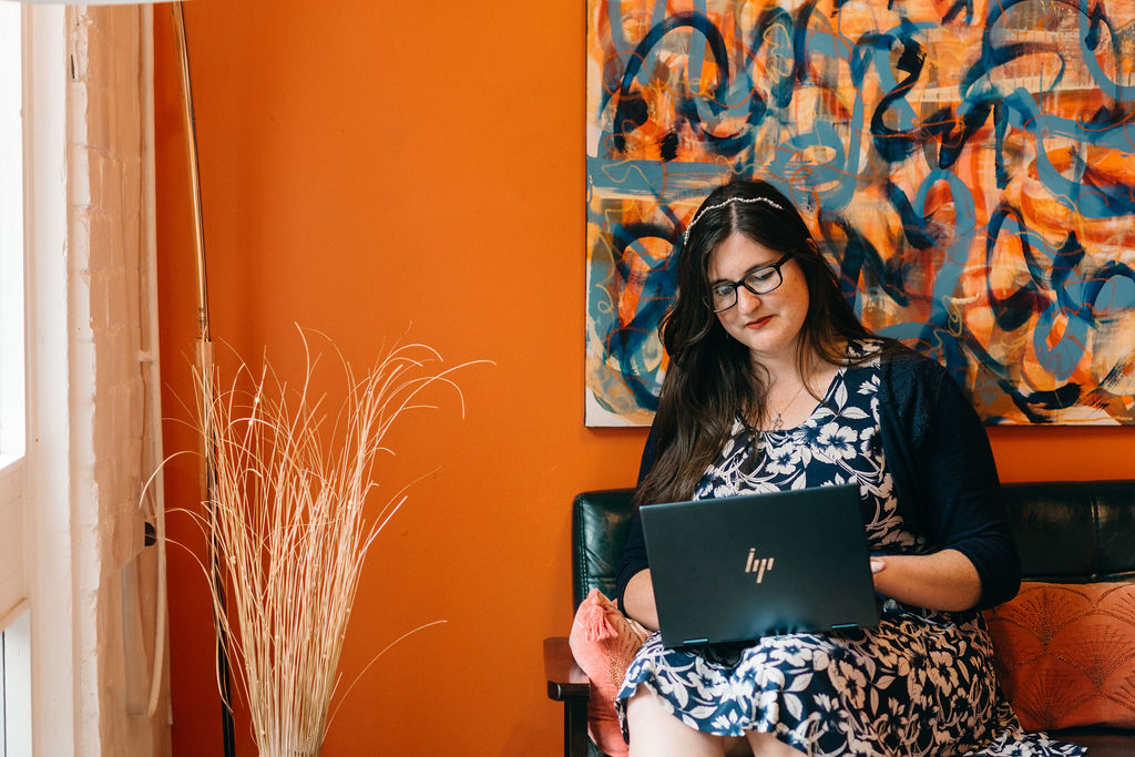 Eleanor Bryan sat in an office working on her laptop.