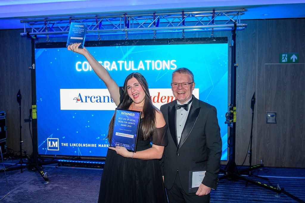 Eleanor Bryan holding her award trophy after winning 'Best Use of Social Media for Growth' at the Lincolnshire Marketing Awards.